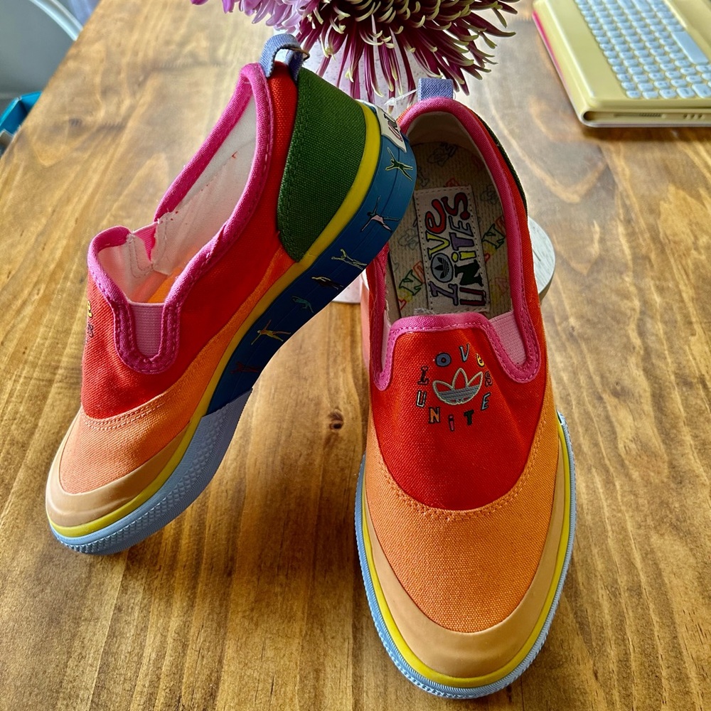 Love Unites Adidas slip on shoes